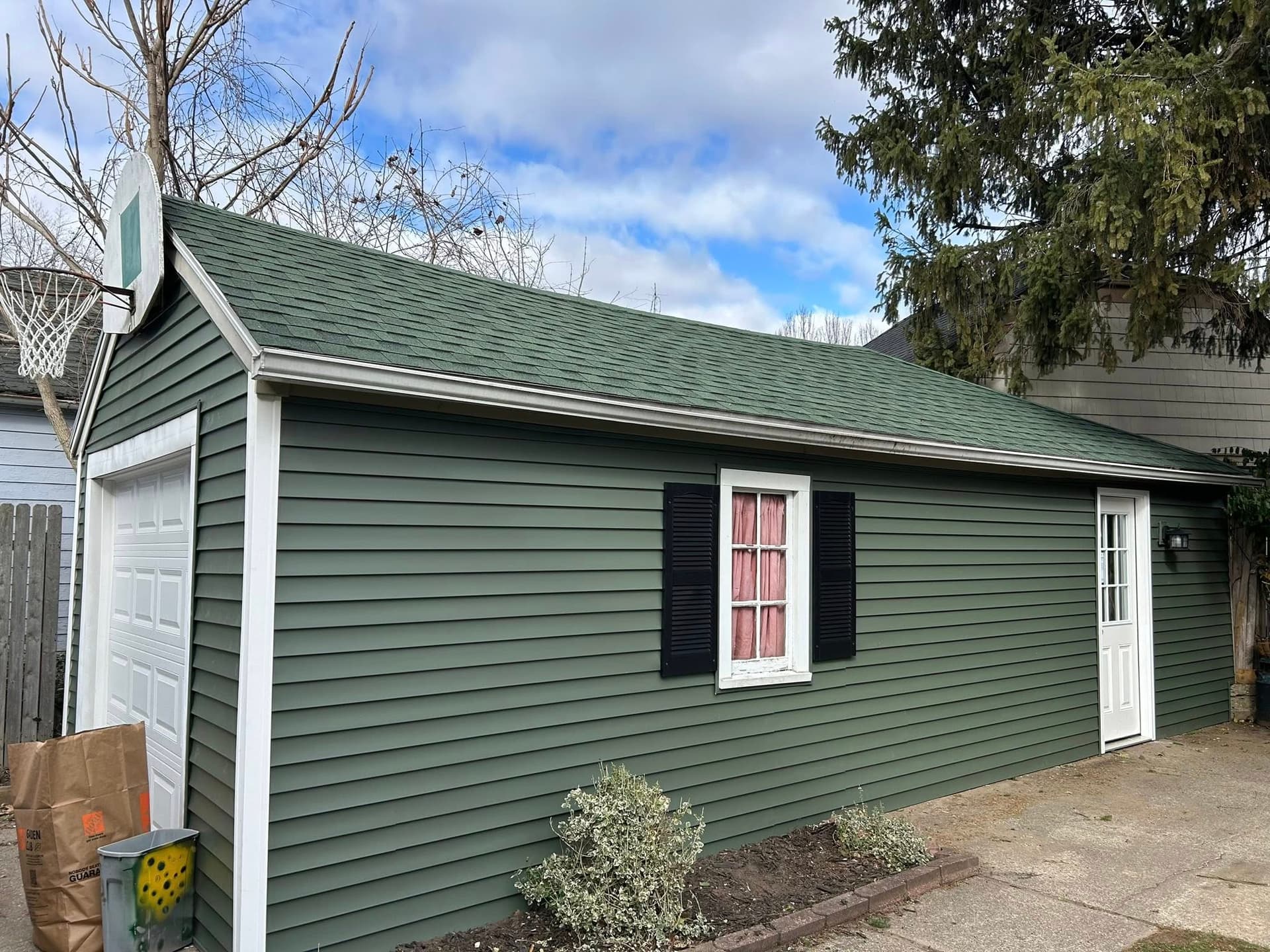 Detached garage — siding May 2025